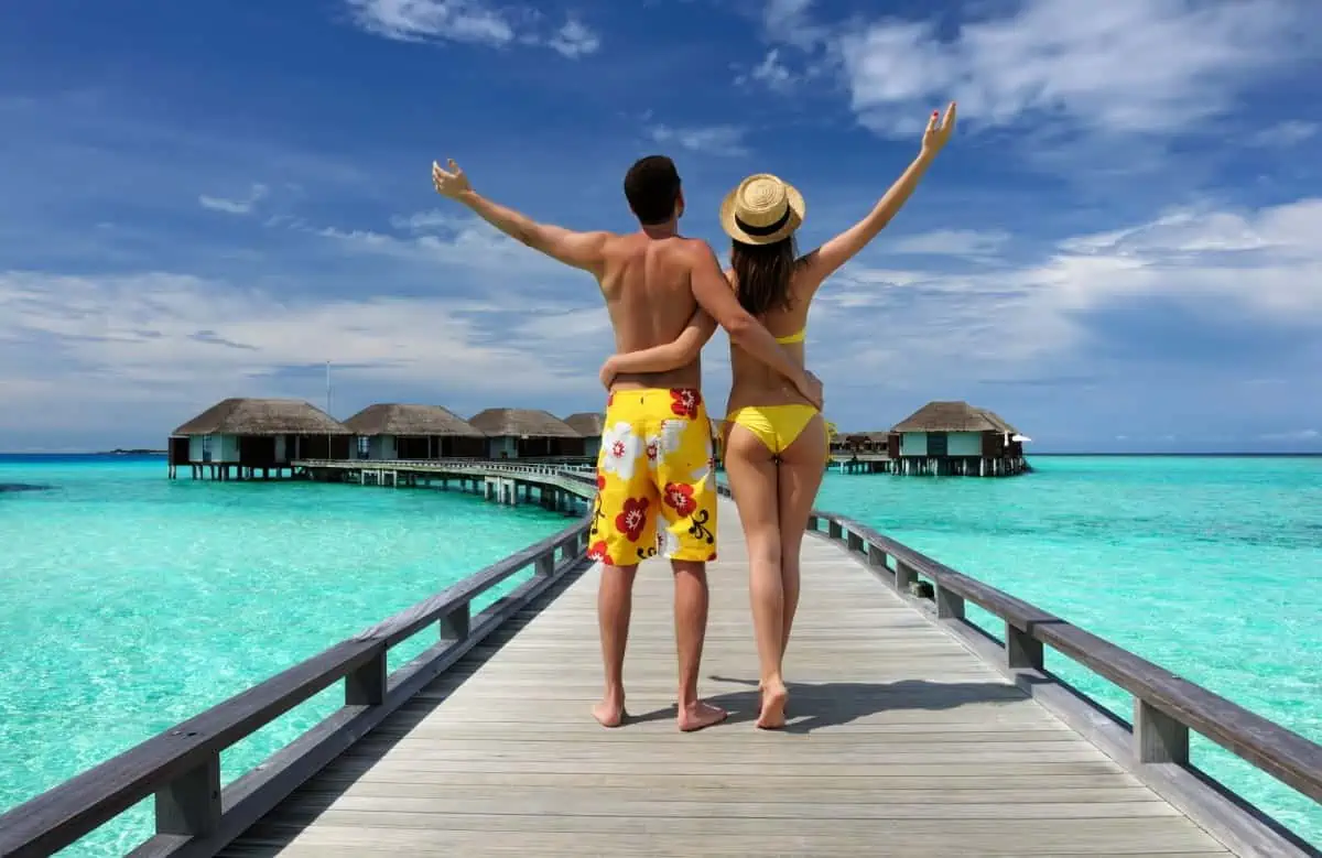 Couple-on-a-Beach-Jetty-at-Maldives