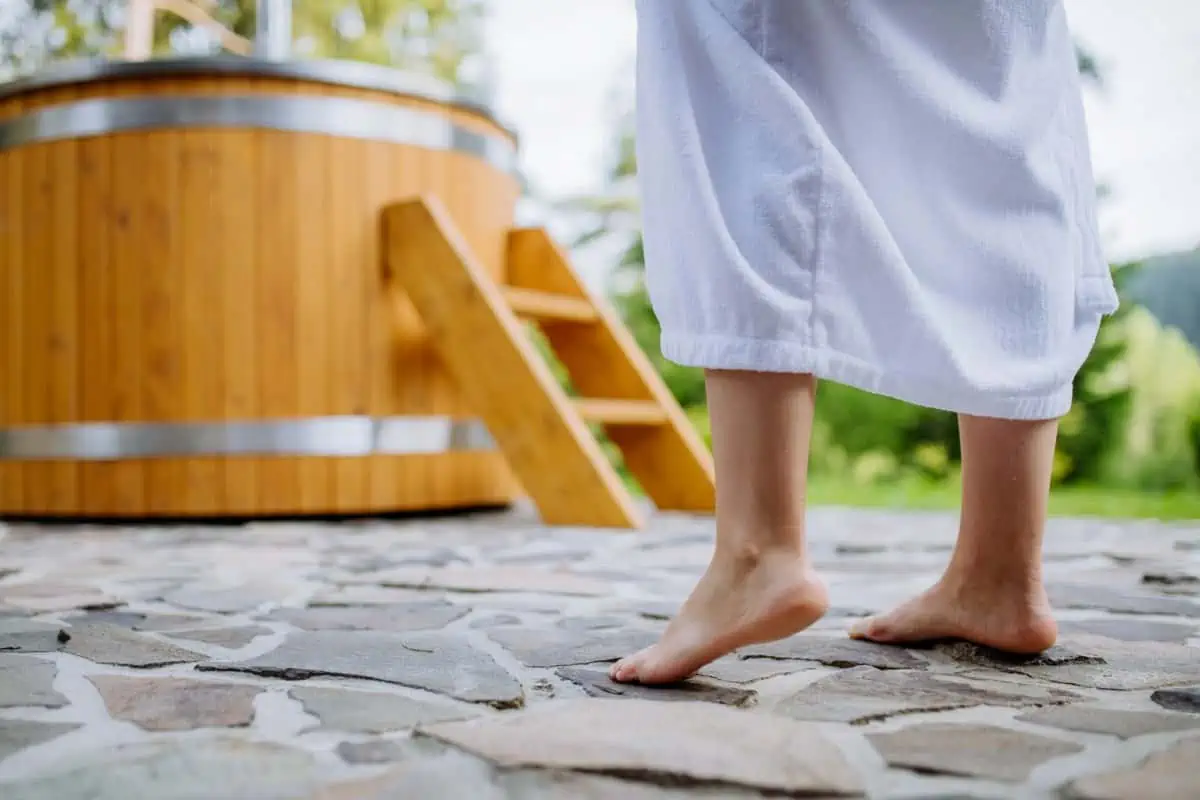 Woman-Standing-Front-of Hot-Tub