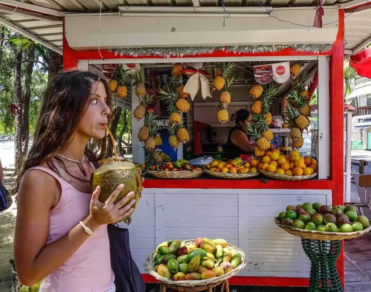 Mauritius-Woman-Drinking-Coconut