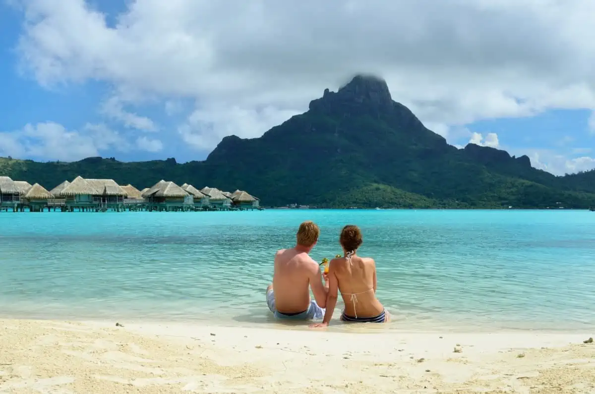 A-Couple-Relaxing-on-Bora-Bora-Beach